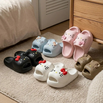 Set of Hello Kitty slides in various colors on a carpeted floor.